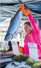  ?? RICHARD LAM/PNG ?? Coho salmon is sold at Steveston’s Fisherman’s Wharf in Richmond.