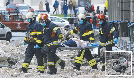  ?? Pictures: AP PHOTO; DARKO BANDIC ?? HEARTBREAK: Firefighte­rs carry a person on a stretcher after the earthquake in Zagreb. The strong quake caused widespread damage and panic (inset).