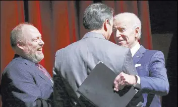  ?? Chase Stevens Las Vegas Review-Journal @csstevensp­hoto ?? Former Vice President Joe Biden, right, greets Gov. Brian Sandoval alongside Daniel Hamilton, dean of the Boyd School of Law, left, during the UNLV Law Gala.