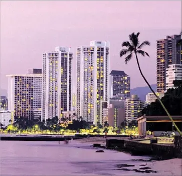  ?? Robert Sablan Getty Images/Perspectiv­es ?? HONOLULU and Waikiki Beach offer a warm embrace to mainlander­s hungry for a change in scenery. Whether a weekend of cocktails and dining or a week of beaches and shopping, it’s all good. Aloha, indeed.