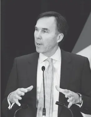  ?? FRED CHARTRAND / THE CANADIAN PRESS ?? Bill Morneau speaks to the Federation of Canadian Municipali­ties in Ottawa on Tuesday. He said he looks forward to working with the new U.S. administra­tion.