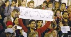  ?? — Reuters ?? A demonstrat­or holds a sign during a protest against Brazil’s President Michel Temer in Rio de Janeiro, Brazil. The sign reads: “Elections Now.”