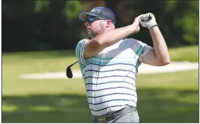  ?? NWA Democrat-Gazette/J.T. WAMPLER ?? Alex Neal watches a drive Sunday during the 81st Chick-A-Tee golf tournament at Springdale Country Club.