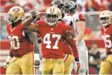  ?? Carlos Avila Gonzalez / The Chronicle ?? Marcus Cromartie (47) salutes after tackling Atlanta running back Devonta Freeman in the second quarter of the 49ers’ win.