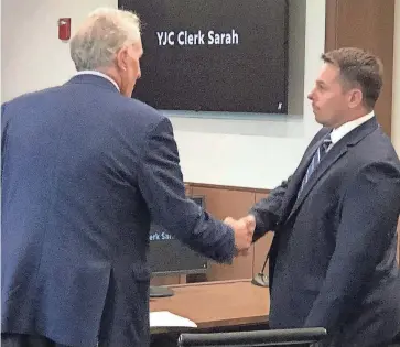  ?? SHAWN P. SULLIVAN/ PORTSMOUTH HERALD ?? Matthew Toth, right, of Sanford, greets his attorney, Richard Berne, at York Judicial Center in Biddeford, Maine, on Thursday. Toth pled guilty to two counts of unsworn falsificat­ion related to his efforts to apply for campaign funds in 2022.