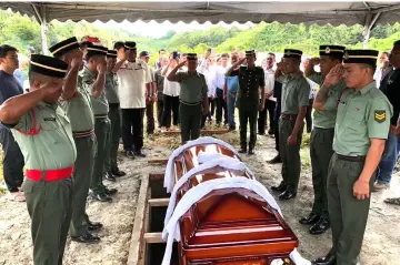  ??  ?? Jimba was accorded a full military burial at the Christian cemetery along Jalan Antaroh on Nov 12.