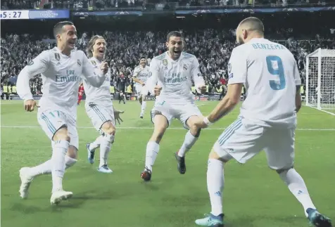  ??  ?? 0 Real Madrid’s Karim Benzema, right, celebrates with Lucas Vazquez, Luka Modric and Mateo Kovacic after scoring his second.