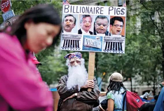  ??  ?? TOO PIGGY TO FAIL: Public outrage over the rapacious practices that led to the 2008 financial crisis spurred the Occupy Wall Street movement but brought about few changes.