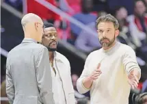  ?? Rob Gray/Associated Press ?? Actor, writer and director Ben Affleck, right, speaks with actor Chris Tucker, center, and NBA Commission­er Adam Silver in Salt Lake City.