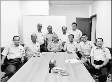  ??  ?? Riot (seated, third left) and DBNA Serian exco members in a group photograph. On his left is Raymond.