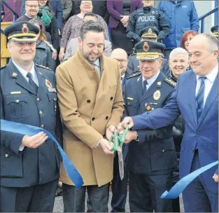  ?? JOE GIBBONS/THE TELEGRAM ?? Cutting the ribbon Thursday at the official grand opening of the RNC’S new Conception Bay South detachment in Manuels, C.B.S., are (from left) detachment 0fficer-in-charge Insp. Alex Brennan, Justice Minister Andrew Pardons, RNC Chief of Police Joe Boland and C.B.S. MHA Barry Petten.