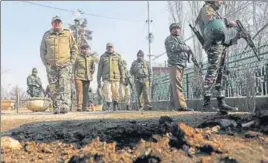  ?? HT PHOTO ?? CRPF men inspect the site of grenade explosion in Srinagar.