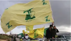  ?? (Aziz Taher/Reuters) ?? HEZBOLLAH SUPPORTERS take part in a parade in Marjayoun in May.