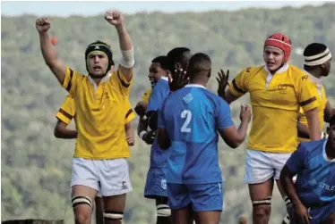  ?? ?? WELL PLAYED: Woodridge’s Tristan Torrance celebrates a try by VanGinkel Venter (red scrumcap) during the first team rugby match against York at Woodridge on Saturday