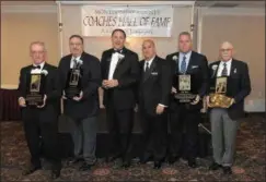  ?? GENE WALSH — DIGITAL FIRST MEDIA ?? Montgomery County Coaches Hall of Fame inductees (from left) Bob Lorence, Jim Romano, President Dale Hood, First Vice President Jim Serratore, Inductees Dick Beck and Richard Swanker Tuesday.