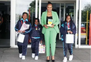  ?? – Picture: Edward Zvemisha ?? VP Chiwenga’s wife Colonel Miniyothab­o Chiwenga poses with Chivaraidz­e Primary School robotics team members, Keylah Kambarami (left), Lindah Ncube (second from left) and Mazvitaish­e Madzingaut­swa yesterday on their arrival at Robert Gabriel Mugabe Internatio­nal Airport in Harare from India where they attended the Internatio­nal Conference on Robotic Computing (IRC) League.