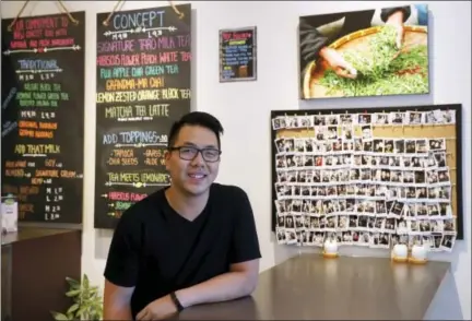  ?? THE ASSOCIATED PRESS ?? In this Friday photo, Mathew Wong poses for portrait at Tea and Milk, a bubble tea shop he co-owns in the Astoria neighborho­od in the Queens borough of New York. Wong and his business partners developed a strategy they hope makes their shop stand out...