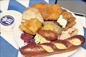  ??  ?? Petite Auberge offers an all-you-can-eat buffet of German and Bavarian food at its annual Oktoberfes­t party Saturday.