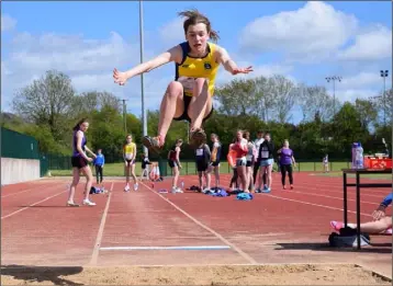  ??  ?? Aisling Kelly of Taghmon is airborne in the girls’ Under-16 long jump.