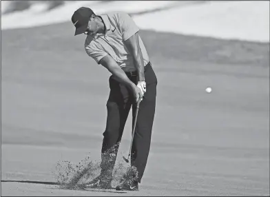  ?? Associated Press ?? Fairway shot: Tiger Woods hits from the first fairway during the final round of the Hero World Challenge golf tournament at Albany Golf Club in Nassau, Bahamas, Sunday.