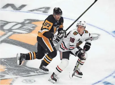 Bedard has assist in NHL debut, Blackhawks beat Crosby, Penguins 4