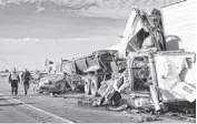  ?? DAVID KADLUBOWSK­I/THE REPUBLIC ?? Arizona Department of Public Safety officers work the scene of a dust-related fatal accident on I-10 on Oct. 29 near Picacho.