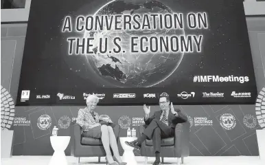  ??  ?? Internatio­nal Monetary Fund Managing Director Christine Lagarde and U.S. Treasury Secretary Steven Mnuchin discuss the U.S. economy during the World Bank/IMF spring meetings in Washington, D.C., on Saturday.