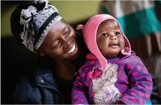  ??  ?? Clockwise from top left: Tony Stuart meets a mother and newborn at a UNICEF-supported hospital; Tony participat­es in a netball game as part of UNICEF’s Sport for Developmen­t program; Siphiwe Khumalo and her happy and healthy baby, Lundiwe. Siphiwe was...