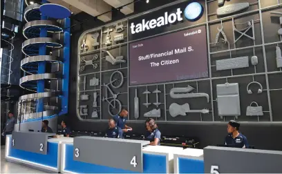  ?? Picture: Neil McCartney ?? MASSIVE. The front desk with the conveyer from the warehouse at Takealot’s pickup point on the bridge over the N1 between Joburg and Pretoria.