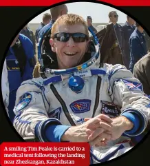  ??  ?? A smiling Tim Peake is carried to a medical tent following the landing near Zhezkazgan, Kazakhstan