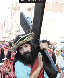  ??  ?? CHRISTIANS in Kolkata, India, participat­e yesterday in a re-enactment of the crucifixio­n of Jesus Christ. Christians around the world observed Good Friday. In the northern Philippine­s at least nine devotees were nailed to wooden crosses while thousands of pilgrims and clergy marched through the ancient stone alleys of Jerusalem’s Old City, retracing Jesus’s path to crucifixio­n. |