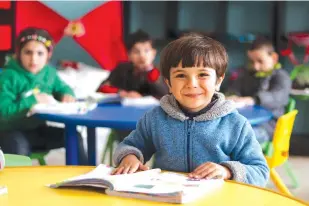  ?? (Khudr Al-Issa/UNICEF) ?? A CHILD sits in a classroom in Syria earlier this year.