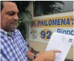  ??  ?? GERMAN Giraldo, director of St Philomena’s home in Sydenham, points to the R500 000 bill that led to their electricit­y being disconnect­ed. | Nqobile Mbonambi African News Agency (ANA)
