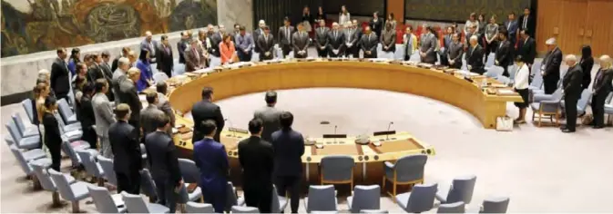  ?? — AP/AFP photos ?? NEW YORK: Members of the United Nations Security Council observe a moment of silence for the victims of the terrorist attack in Manchester, England, before a meeting at UN headquarte­rs, yesterday.