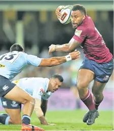  ?? Photo: Zimbio. ?? Reds centre Samu Kerevi evades the Waratahs defenders at the Sydney Cricket Ground on April 14, 2018.