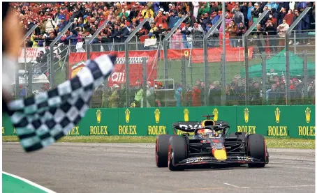  ?? REUTERS ?? Smooth finish: Red Bull’s Max Verstappen crosses the finish line to win the Emilia Romagna Grand Prix.