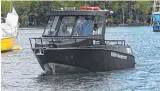  ?? Picture: STEWART McLEAN ?? TOOLKIT: Member for Barron River Craig Crawford and Environmen­t Minister Dr Steven Miles take a ride on the new boat with EPH North Queensland Wildlife Manager Michael Joyce.