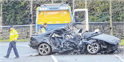  ??  ?? Crash scene: (left and below) The wreckage of the Audi A6 on Killala Road in Co Mayo in which two died; below, victims Ricky Langdon (left) and Jack O’Hora