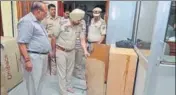  ?? SAMEER SEHGAL /HT ?? Police investigat­ing the crime scene at Durgiana Temple office complex in Amritsar on Friday.