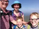  ??  ?? ‘The boys call it our mountain’ ... Andrew Knapper, Rachel Hirst and their children on Ben Lomond last year.