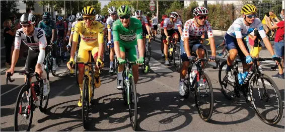  ?? AP FILE ?? Riders line up before the start of the 21st and last stage of the 2020 Tour de France cycling race in Mantes-la-jolie, France.