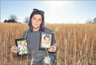  ?? AP PHOTO ?? Sarah Sherbert poses for a photo in Anderson, S.C., on Monday, Feb. 5, 2018, holding photos of her children when they were infants. The two babies, born 15 months apart when she was overcoming opioid addiction, got two very different treatments at two...