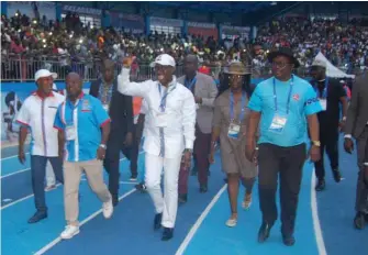  ??  ?? Delta State Governor, Dr Ifeanyi Arthur Okowa, (centre), acknowledg­ing cheers from athletes and fans at the closing ceremony of the 21st African Senior Athletics Championsh­ip in Asaba, Delta State…last night