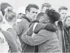  ??  ?? Paducah Tilghman High School students welcome students from Marshall County High School to a group prayer. MICHAEL CLEVENGER/USA TODAY NETWORK