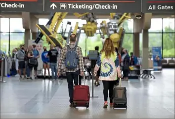  ?? Pam Panchak/Post-Gazette ?? Travelers at Pittsburgh Internatio­nal Airport will be able to fly to Indianapol­is and Milwaukee starting on Oct. 12.