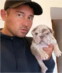  ?? ?? Posing: Karl Shellard, 43, with one of the puppies