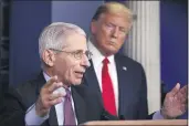  ?? ALEX BRANDON — THE ASSOCIATED PRESS ?? President Donald Trump watches as Dr. Anthony Fauci, director of the National Institute of Allergy and Infectious Diseases, speaks about the coronaviru­s in the James Brady Press Briefing Room of the White House in Washington on April 22.