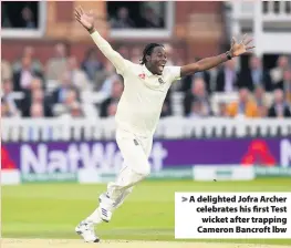  ??  ?? > A delighted Jofra Archer celebrates his first Test wicket after trapping Cameron Bancroft lbw