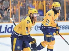  ?? CHRISTOPHE­R HANEWINCKE­L, USA TODAY SPORTS ?? Ryan Ellis, left, ranks No. 1 in defenseman scoring, and P.K. Subban, right, is among the leaders in Corsi ratings.