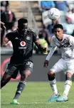  ?? GAVIN BARKER Backpagepi­x ?? ORLANDO Pirates goalscorer Eva Nga is challenged by Swallows’ Junaid Sait yesterday. |